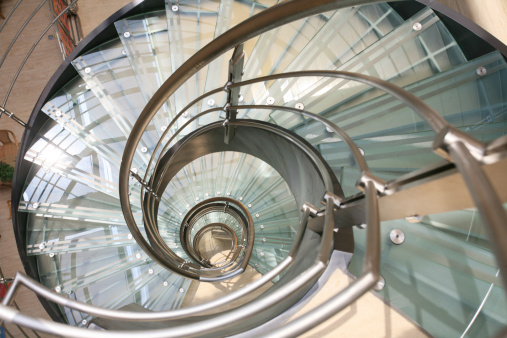 Modern glass stairs in plush new apartment. high key light and airy feel. 