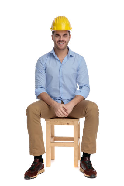 istock Happy casual man wearing hard hat and smiling 1213153428