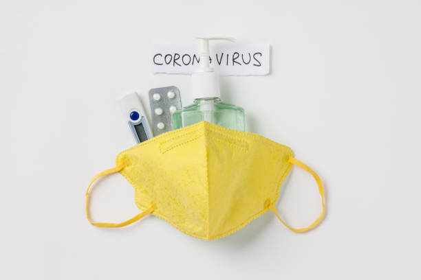 Coronavirus prevention medical surgical masks, thermometer, pills and hand sanitizer gel Coronavirus prevention medical surgical masks, thermometer, pills and hand sanitizer gel for hand hygiene corona virus protection. Flat lay earth first aid stock pictures, royalty-free photos & images