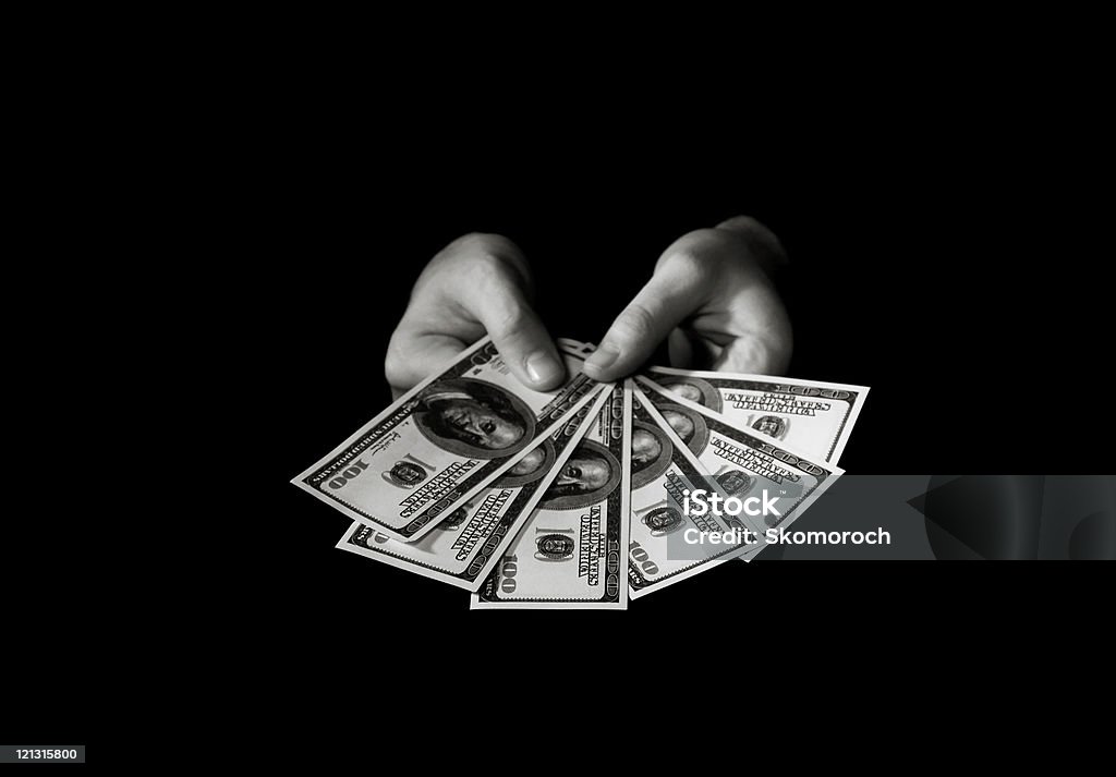 Mãos com dólares sobre preto - Foto de stock de Amontoamento royalty-free