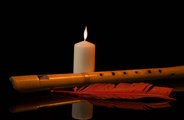 istock Still Life with flute,  candle and red feather 121315805