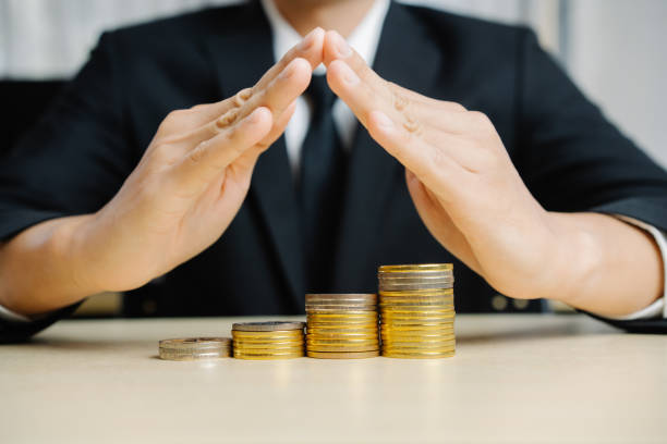 istock Businessman working with coin money currency. 1213159247