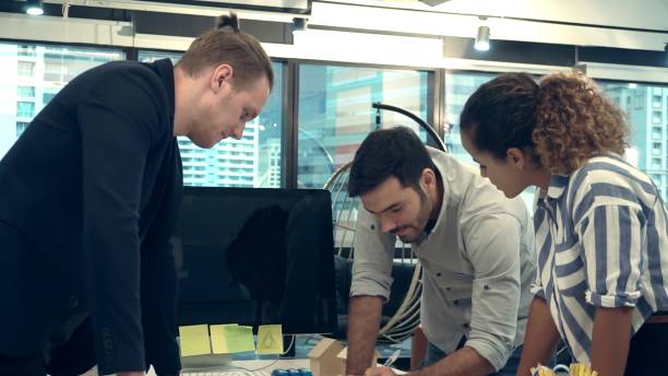 istock Creative business people group having conversation at office desk in workplace. 1213160864