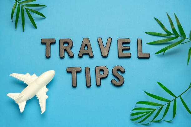 istock summer flat lay travel tips note , plane and palm leaves on a blue background 1213162447