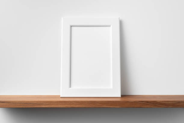 istock vertical white wood photo on bookshelf and wall 1213166154