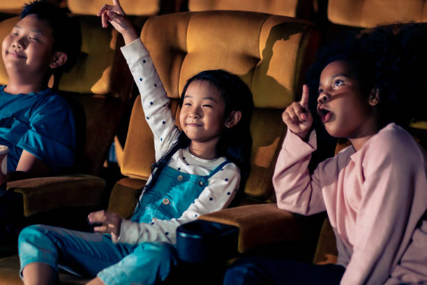 istock Three children having fun watching movie 1213166204
