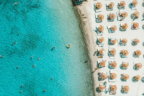 istock people relaxing on the beach 1213170233
