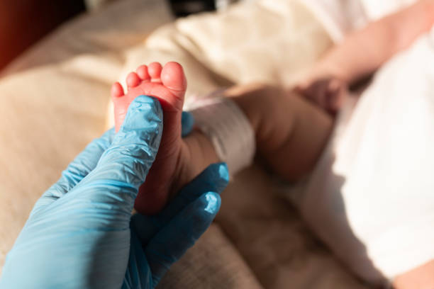 istock A baby's foot in mother hands 1213170666
