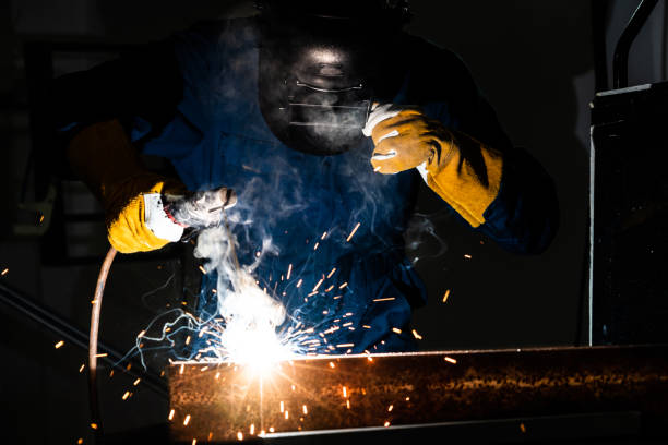 istock Metal welder working with arc welding machine. 1213171852