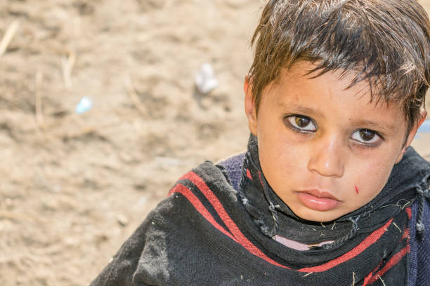 istock a lonely refugee child and sad expressions on his face 1213175214