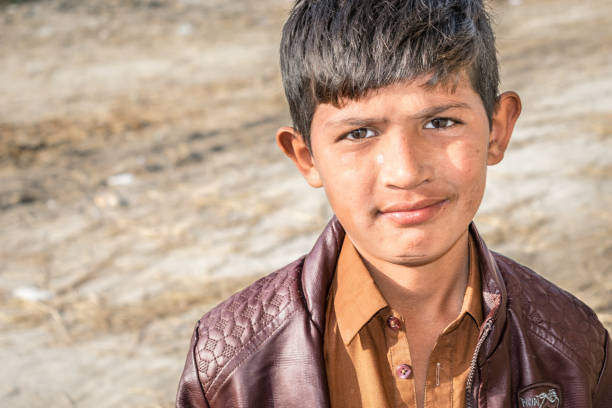 istock a lonely refugee child and sad expressions on his face 1213175224