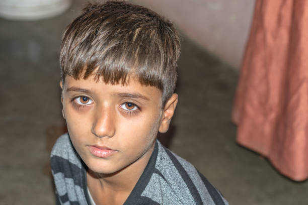 istock a lonely refugee child and sad expressions on his face 1213176429