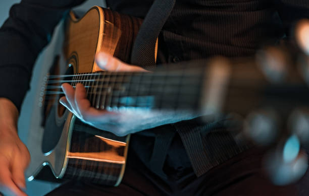 istock Man playing acoustic guitar 1213176641