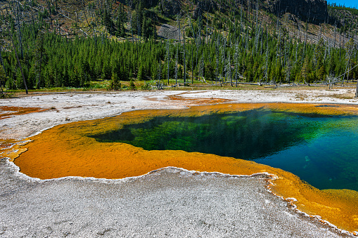 Orange-blue Colored Black Sand Basin lake in Yellowstone National Park, Wyoming, USA.Nikon D3x