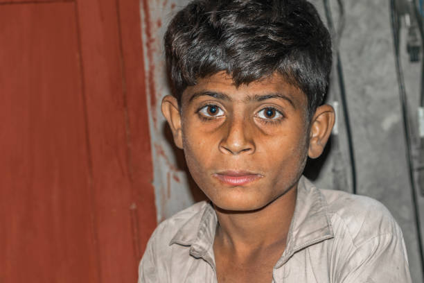 istock a lonely refugee child and sad expressions on his face 1213176928