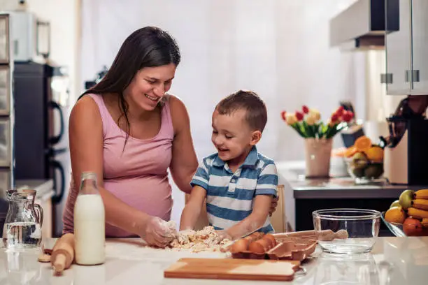 Photo of Happy mother and son in the kitchen