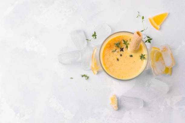 istock lassi drink mango shot in top view on a white background with place for text. Milkshake 1213178702