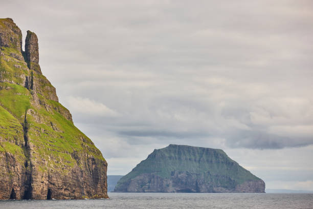 Faroe islands green landscape and atlantic ocean. Vagar Faroe islands green landscape and atlantic ocean. Vagar area vágar photos stock pictures, royalty-free photos & images