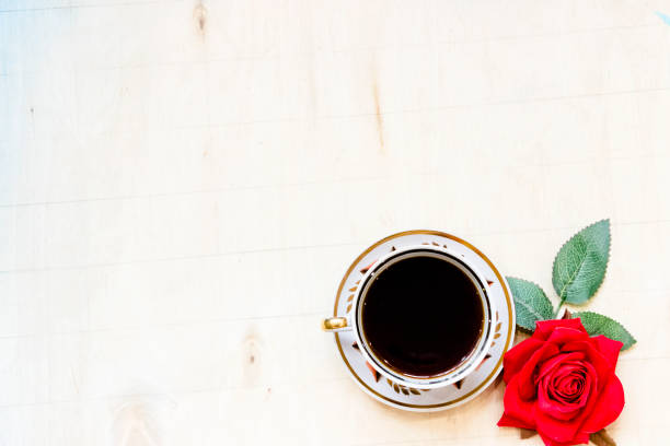 istock Cup of coffe and open notebook on white background 1213180963