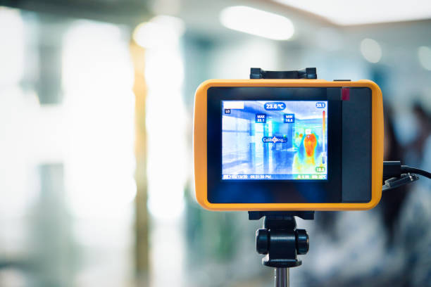 istock People waiting for temperature check by thermoscan 1213183428