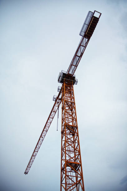 istock Big tower crane against a cloudy sky 1213184610