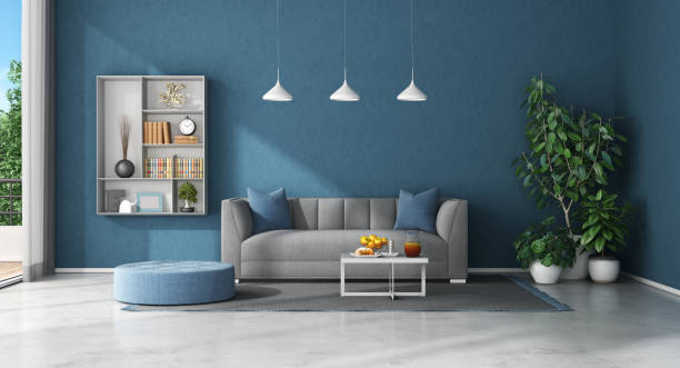 Blue living room with sofa and bookcase Minimalist living room with sofa and bookcase on blue wall - 3d rendering
Note: the room does not exist in reality, Property model is not necessary royal blue curtains stock pictures, royalty-free photos & images