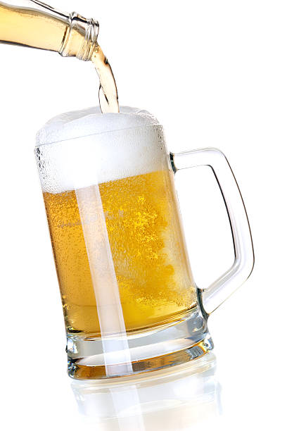 istock Beer is pouring into a glass from bottle 121318710