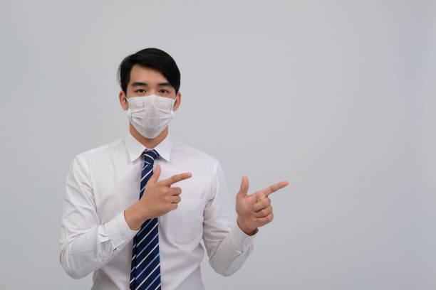 istock businessman man wearing protective mask against cold flu virus bacteria infection pollution 1213187349