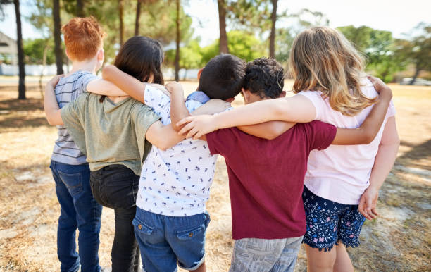 istock Kids chilling at the park 1213188952
