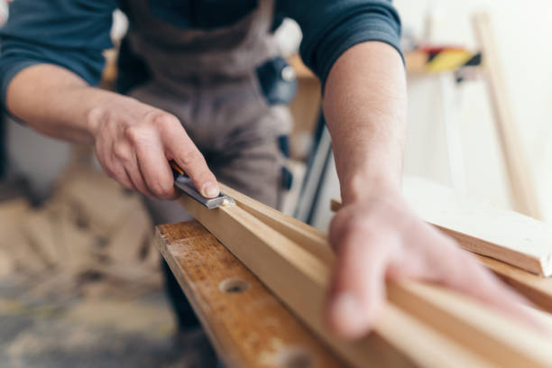 istock Carpenter grinding wooden lath 1213190244