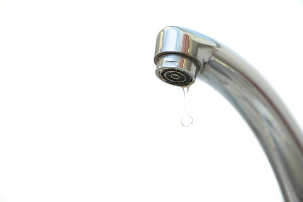 istock water dripping from the tap and isolated white background 1213192440