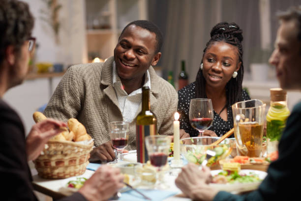 istock African couple sitting at holiday table 1213192754