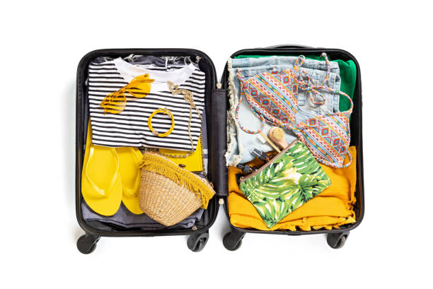 istock Flat lay with open suitcase with casual clothes for summer vacations over white background. Summer holidays, travel, tourism, flight luggage concept. 1213194632