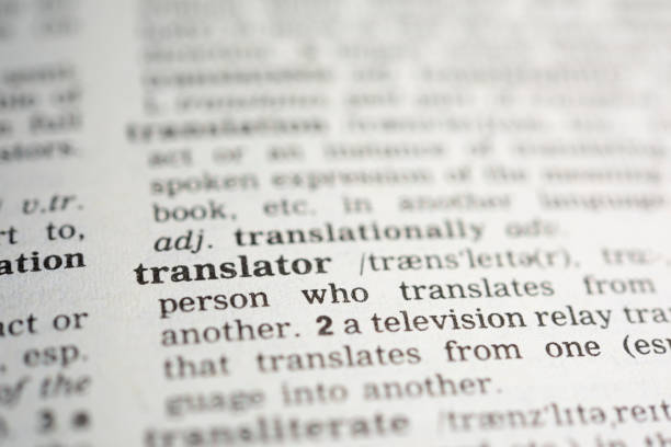 istock Translator Word Definition in Printed Paper Dictionary 1213196128