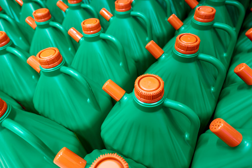 pattern of green plastic bottles with red cap