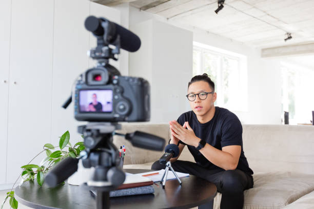 istock Young man recording a video blog 1213201592