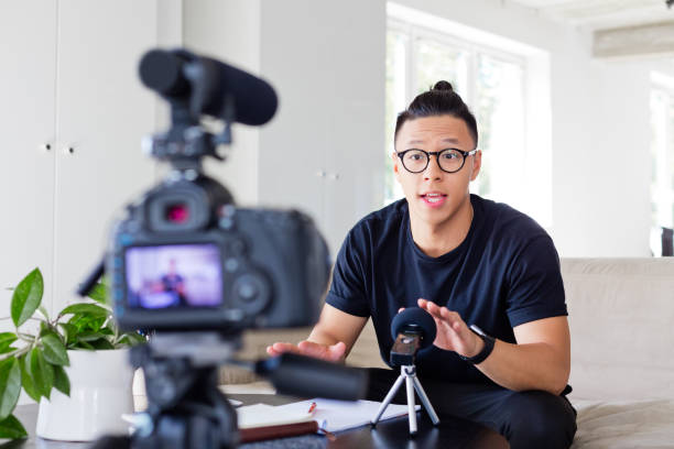 istock Young man recording a video blog 1213201797