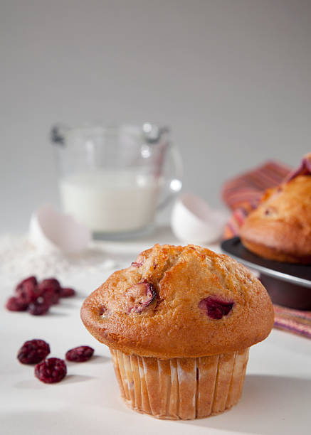 istock Cranberry muffin on a table with cranberries and ingredients 121320274