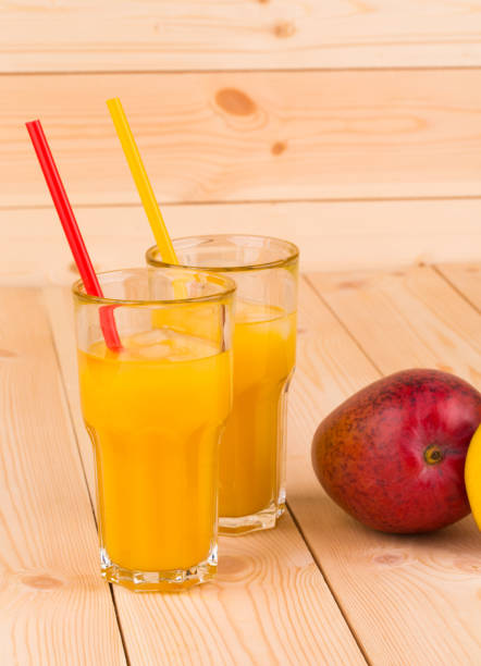 istock Still life with mango juice with mango fruits. 1213202745