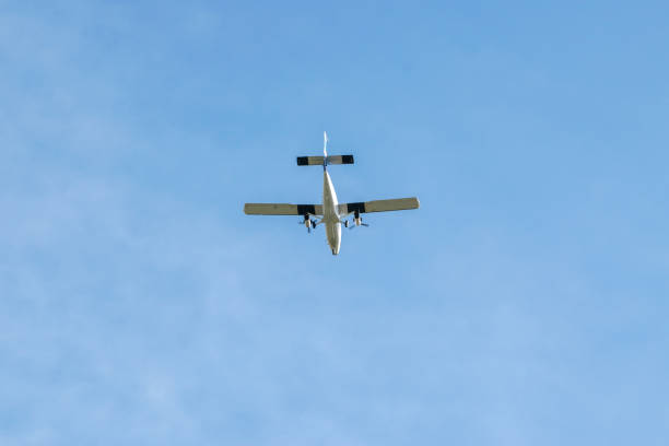 istock Light Aircraft flying overhead against a blue sky 1213203228
