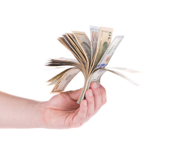 istock Hand holds a bunch of american dollar bills. 1213203229
