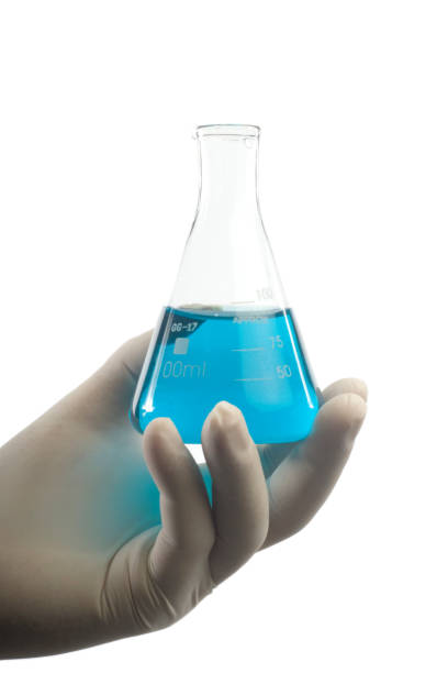 istock Male Scientist is Working on A Cure For Coronavirus Covid-19  with Beaker on White 1213207047