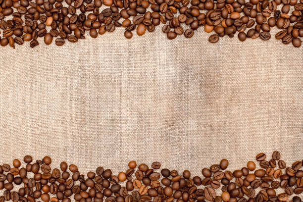istock The frame is made of burlap and coffee beans, with space for your creativity, text. Coffee beans on a coarse cloth 1213212317