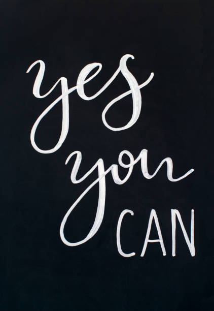 istock Chalk inscription YES YOU CAN on a black chalkboard 1213217190