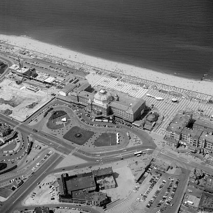 Scheveningen, Holland, June 20 - 1975: Historical aerial photo in black and white of the Kurhaus near the beach of Scheveningen, town district of The Hague