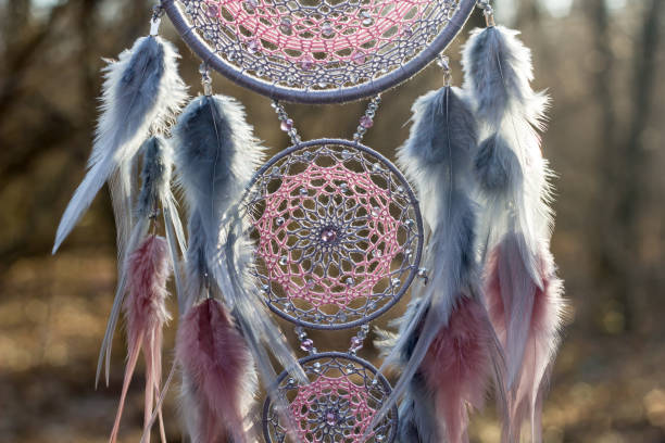istock Handmade dream catcher with feathers threads and beads rope hanging 1213220421
