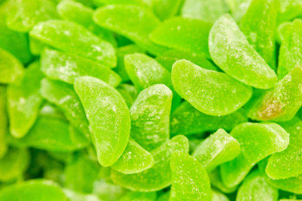 Background and texture of sweets from marmalade green. Close up.