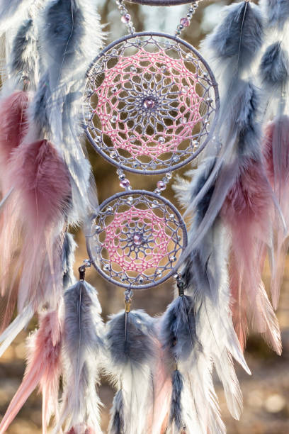 istock Handmade dream catcher with feathers threads and beads rope hanging 1213220458