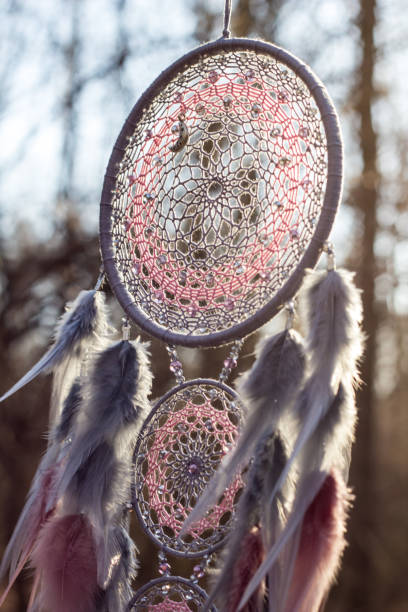 istock Handmade dream catcher with feathers threads and beads rope hanging 1213220471