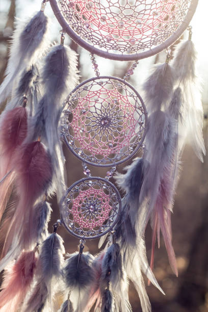 istock Handmade dream catcher with feathers threads and beads rope hanging 1213220790